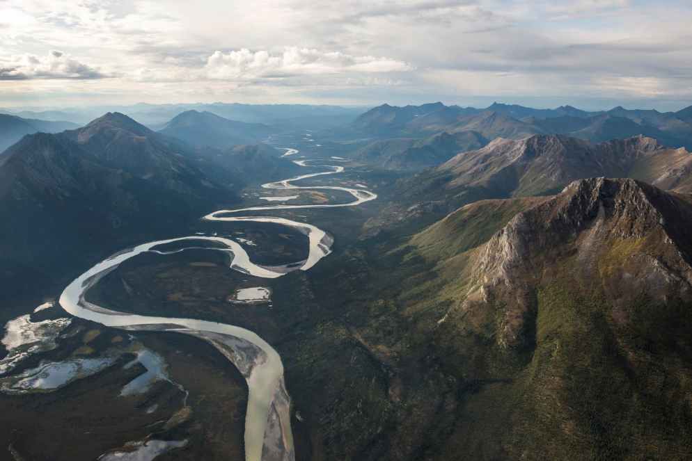 green mountains and flowing river